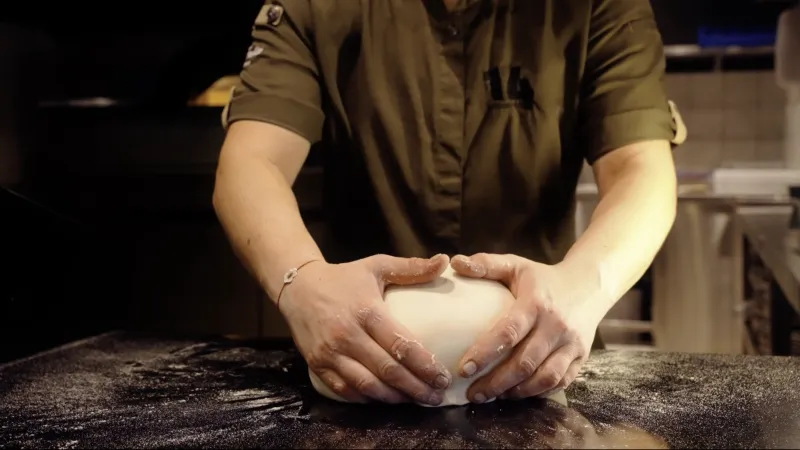 Man making pizza dough